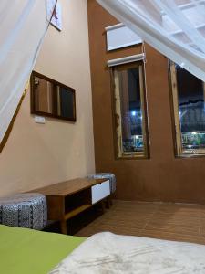 Postel nebo postele na pokoji v ubytování Sempurna Guest House & Jungle Trekking