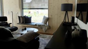 a living room with a couch and a table at Widderkopf in Oberstaufen