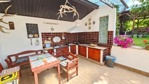an outdoor kitchen with a table and a counter at Casa Vanatorului in Sighişoara +72 photos