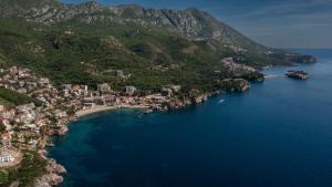 an aerial view of a beach on a mountain at Apartments Raymond in Sveti Stefan