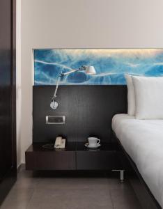 Postel nebo postele na pokoji v ubytování Kos Aktis Art Hotel + 37 fotografií
