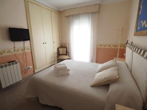 Postel nebo postele na pokoji v ubytování Ca la Lela