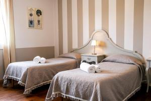 Postel nebo postele na pokoji v ubytování Hotel Volta