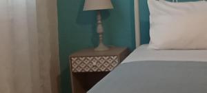 A bed or beds in a room at Sweet Maisonette in Corfu Town