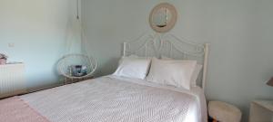 A bed or beds in a room at Sweet Maisonette in Corfu Town