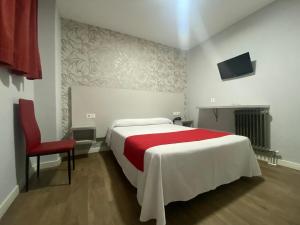 Postel nebo postele na pokoji v ubytování Hostal Sonia Granada