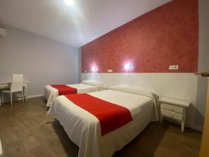 Postel nebo postele na pokoji v ubytování Hostal Sonia Granada