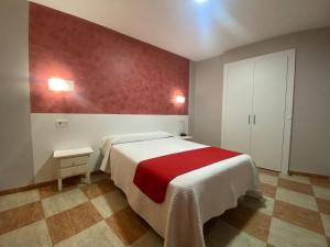 Postel nebo postele na pokoji v ubytování Hostal Sonia Granada