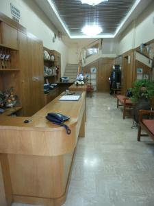 a room with a reception desk with a phone on it at Hotel Manzoni in Ponte San Giovanni