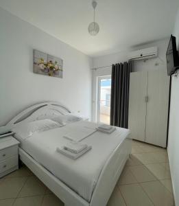 Postel nebo postele na pokoji v ubytování Joni Apartments