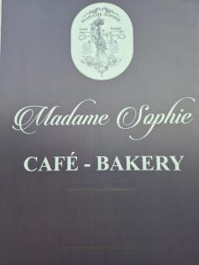 a sign that says alabama agriculture cafe bakery at Elena House Apartments in Viareggio