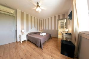 Postel nebo postele na pokoji v ubytování Hotel Volta