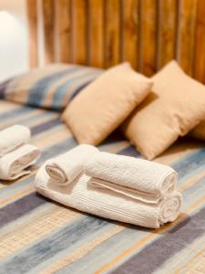 a pile of towels sitting on top of a table at Il Maestrale in La Maddalena