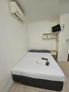 Postel nebo postele na pokoji v ubytování Clermont Hotel Motel