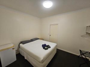 Postel nebo postele na pokoji v ubytování Clermont Hotel Motel