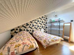 a small bedroom with a bed and a mirror at Maison de ville à Berck Plage, terrasse et garage, proche plage et commerces - FR-1-646-65 in Berck-sur-Mer +5 photos