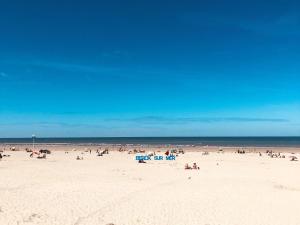 a large group of people on a beach at Maison de ville à Berck Plage, terrasse et garage, proche plage et commerces - FR-1-646-65 in Berck-sur-Mer