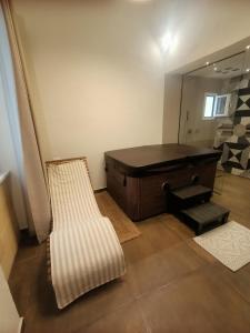 a bath room with a tub and a mirror at Casa Anita in Marsala +25 photos