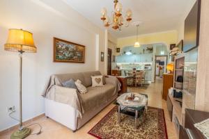 a living room with a couch and a table at Doris House by GuestCorfu in Corfu Town