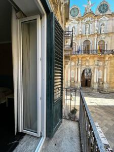 an open door on a balcony of a building at Casa Garibaldi in Trapani