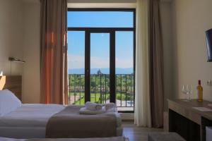 Voodi või voodid majutusasutuse In Gremi Hotel toas