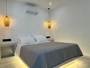 Voodi või voodid majutusasutuse Aphrodite Hotel & Apartments toas