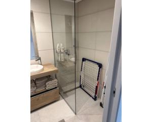 a bathroom with a glass shower and a sink at Oasis Beach 13 Casa del Guardamar in Alicante +25 photos