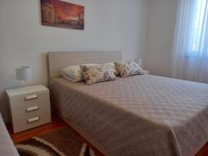 Postel nebo postele na pokoji v ubytování Apartman Martina