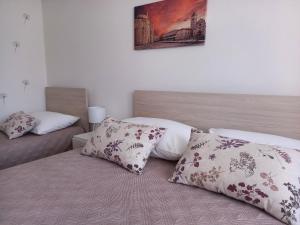 Postel nebo postele na pokoji v ubytování Apartman Martina