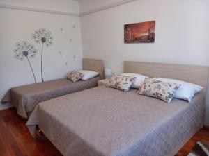 Postel nebo postele na pokoji v ubytování Apartman Martina