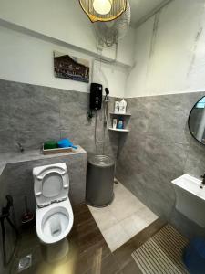 a bathroom with a toilet and a sink at Room in Bayanlepas in Gelugor