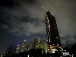 a tall building in a city at night at Room in Bayanlepas in Gelugor