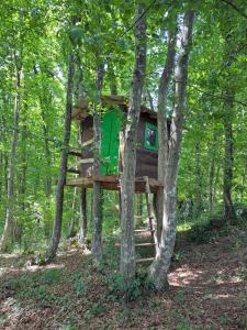 a tree house in the middle of the woods at Bakina iža in Duga Resa