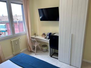 TV a/nebo společenská místnost v ubytování Urban Suite Milano
