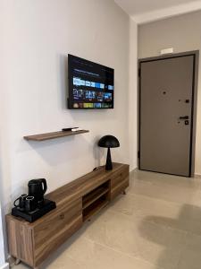 TV a/nebo společenská místnost v ubytování Munda suites