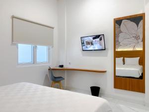 Cordex Hotel Marelan Medan客房内的一张或多张床位