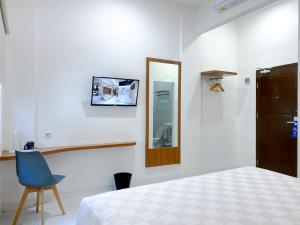 Cordex Hotel Marelan Medan客房内的一张或多张床位