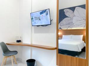 Cordex Hotel Marelan Medan客房内的一张或多张床位