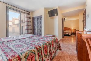 Postel nebo postele na pokoji v ubytování Hotel Mora
