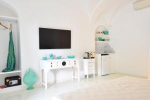 TV a/nebo společenská místnost v ubytování Casa Mulini