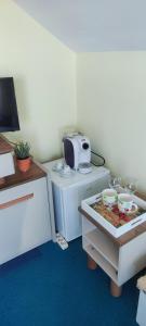 a kitchen with a stove and a microwave at Hotel Neptun - Lozenets in Lozenets