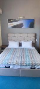 a bed in a room with at Hotel Neptun - Lozenets in Lozenets