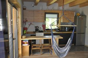 a hammock hanging in a kitchen in a tiny house at Cataleya Rajcza in Rajcza