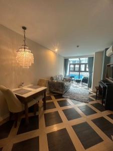 a living room with a table and a couch at Espana Condo Resort Pattaya Sai2 in Pattaya South