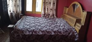 Letto o letti in una camera di Mir manzil