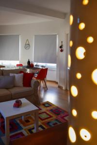 a living room with a couch and a table at B&b A casa di Lò CIN F3325 in Baunei