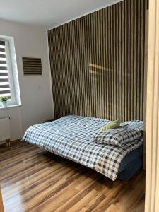 Postel nebo postele na pokoji v ubytování Pokoje w Nowosolnej