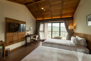 Voodi või voodid majutusasutuse HLS Dalat Lodge toas