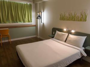 Кровать или кровати в номере ibis budget RJ Praia de Botafogo