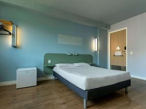 Кровать или кровати в номере ibis budget RJ Praia de Botafogo